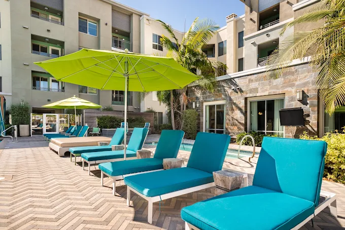 Luxury hotel pool deck with outdoor lounge cushions